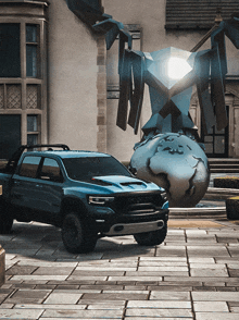 a ram truck is parked in front of a statue of a robot