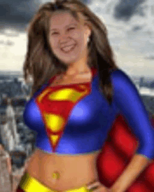 a woman is wearing a superman costume and smiling