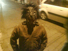 a man with a wolf mask on his face