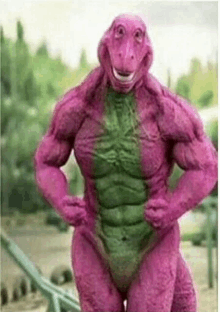 a very muscular purple dinosaur is standing with his hands on his hips in a park .