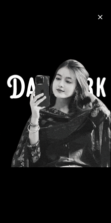 a black and white photo of a woman taking a selfie with the word dark in the corner