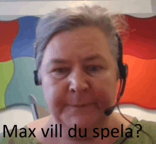 a woman wearing a headset has the words max vill du spela written on her face