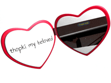 a pair of heart shaped sunglasses with the words " thopki my beloved " written on them