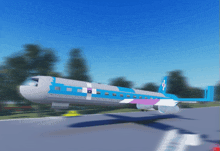 a blue and white airplane with a cross on the tail is taking off