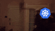 a blurred image of a person with a blue sign in front of their face that says ' x ' on it