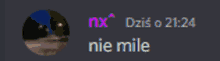 a blurred image of a person with the words nx dzis o 21:26 nie mile below it