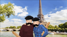 two men with fake mustaches and beret posing for a picture in front of the eiffel tower