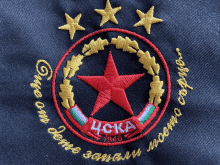 a red star with a wreath around it and the word cka on it