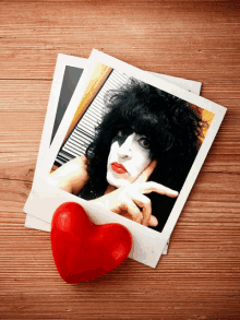 a picture of a woman with a red heart behind her