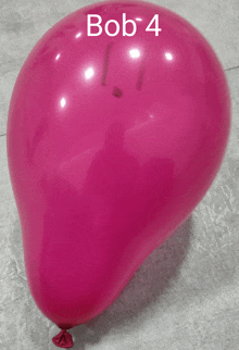 a pink balloon with bob 4 written on the side