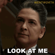 a woman says look at me in front of a wentworth logo