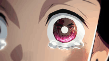 a close up of a person 's eye with tears running down it