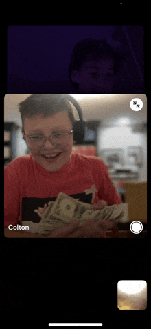 a phone screen shows a boy holding a stack of money and colton 's face in the background