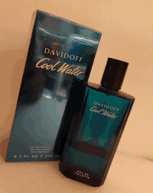 a bottle of davidoff cool water is next to its box