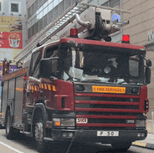 a red fire truck with a license plate that says f 50