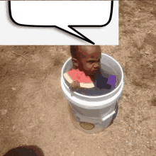 a child in a bucket with a speech bubble above it