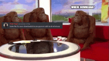 three orangutans are sitting around a table with a pink floyd message on the bottom