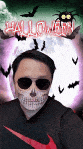 a man wearing sunglasses and a skull mask with the word halloween written on it