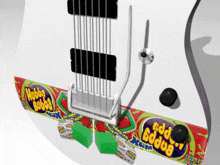 a close up of a guitar with a candy wrapper that says hobba bobba