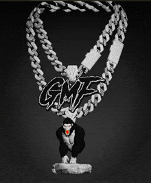 a necklace with a gorilla and the word gmf