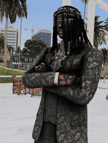 a man with dreadlocks is standing with his arms crossed wearing a black jacket with the letter e on it