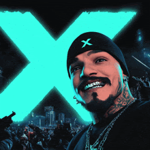 a man wearing a black hat with an x on it is smiling