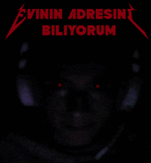 a man with red eyes and the words evinin adresini biliorum