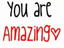 a sign that says " you are amazing " with a heart in the middle