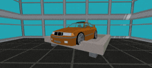 an orange bmw is on display in a room with a lot of windows