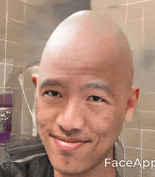 a man with a bald head is smiling in a bathroom