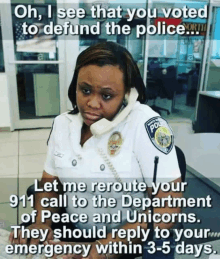 a woman in a police uniform is talking on a telephone