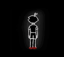 a drawing of a boy standing in the dark with a red shoe .