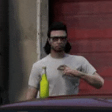 a man in a white shirt is standing next to a yellow bottle of beer .