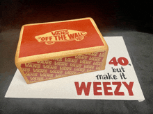 a cake with a vans off the wall logo on it