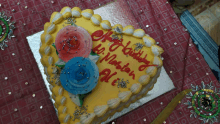 a heart shaped cake with the words happy birthday hi maslah ali on it