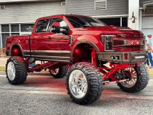 a red truck with the word sotex on the front of it