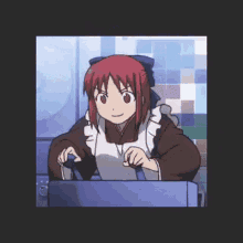 a girl with red hair is sitting in front of a laptop computer