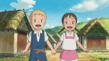 a boy and a girl holding hands in front of a village