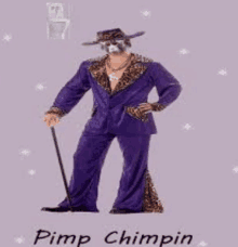 a man in a purple suit is holding a cane and wearing a leopard print hat .