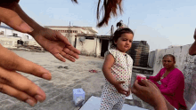 a little girl wearing a princess crown stands in front of a water tank that says ' sds ' on it