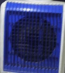 a blue and white fan with a blue grille on it