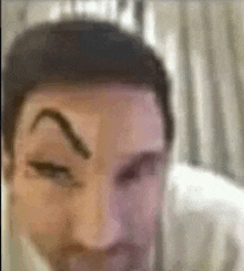 a close up of a man 's face with eyebrows .