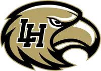 a black and gold eagle head with the letter h on it