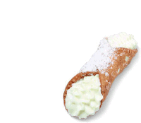 a cannoli with whipped cream and powdered sugar on it