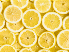 a pile of sliced lemons are stacked on top of each other .