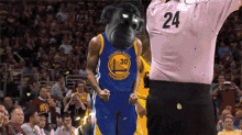 a golden state warriors player wearing a monkey head