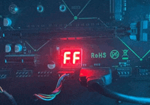 a close up of a motherboard with a red display that says ff rohs .