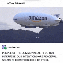 an amazon blimp is flying over a mountain