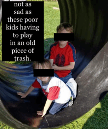 two children playing in an old piece of trash