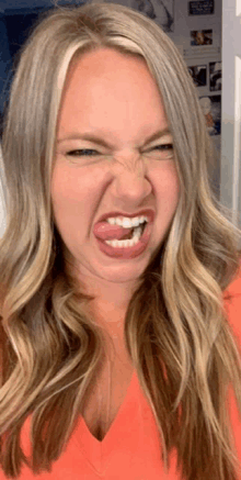 a woman making a face with her tongue out